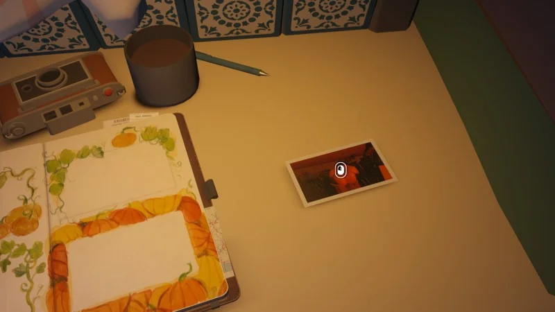 A developed photograph beside Alfred's open journal